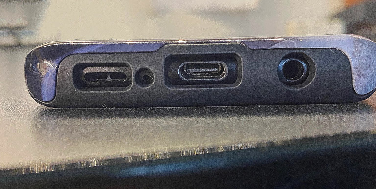 A view of the bottom of the phone case with phone jack and USB